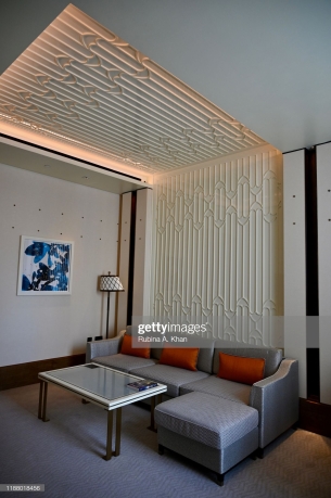DOHA, QATAR - NOVEMBER 15: A Junior Suite living room with the fretwork sand dunes and metallic studs above the art work on the walls resembling the old wooden beams in Qatari homes called 'danshal' which extend horizontally from walls at the Mandarin Oriental Doha on November 15, 2019 in Doha, Qatar. (Photo by Rubina A. Khan/Getty Images)