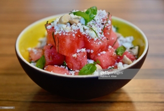 DOHA, QATAR - NOVEMBER 17: A Watermelon Salad with Feta Cheese and Orange Confit at the outdoor terrace at Izu, a Mediterranean cuisine restaurant named after its Nigerian chef, Izu Ani, facing the Barahat Msheireb Town Square at the Mandarin Oriental, Doha on November 17, 2019 in Doha, Qatar. (Photo by Rubina A. Khan/Getty Images)